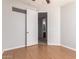 Bedroom featuring a ceiling fan with open door to attached bathroom and vinyl wood flooring at 2090 S Dorsey Ln # 1020, Tempe, AZ 85282