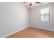Bedroom featuring a ceiling fan with vinyl wood flooring and a bright window with blinds at 2090 S Dorsey Ln # 1020, Tempe, AZ 85282