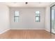 This bedroom features bright floors, bright walls, a ceiling fan, and walk-out access to a balcony at 2090 S Dorsey Ln # 1020, Tempe, AZ 85282