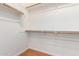 A well-organized walk-in closet featuring wooden racks and shelves, perfect for storage solutions at 2090 S Dorsey Ln # 1020, Tempe, AZ 85282