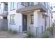 Charming condo entrance with a blue door, modern accents, and neat landscaping at 2090 S Dorsey Ln # 1020, Tempe, AZ 85282