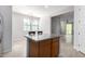 Open floor plan with kitchen island and dining area at 2090 S Dorsey Ln # 1020, Tempe, AZ 85282