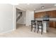 Well-lit kitchen features ample wood cabinetry, granite countertops, and stainless steel appliances at 2090 S Dorsey Ln # 1020, Tempe, AZ 85282