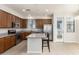 Modern kitchen boasts a center island with seating, stainless steel appliances, and ample counter space at 2090 S Dorsey Ln # 1020, Tempe, AZ 85282