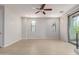 Bright living room features recessed lighting, a ceiling fan, bright walls, and walk-out access to a balcony at 2090 S Dorsey Ln # 1020, Tempe, AZ 85282