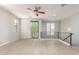 Open-concept living space with large sliding door and wood floors at 2090 S Dorsey Ln # 1020, Tempe, AZ 85282