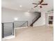 Open-concept living space with staircase, modern railing and wood floors at 2090 S Dorsey Ln # 1020, Tempe, AZ 85282