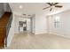 Bright, open-concept living space flows into the kitchen, featuring a ceiling fan and natural light at 2090 S Dorsey Ln # 1020, Tempe, AZ 85282