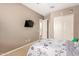 Neutral-toned bedroom with plush carpet and charming animal decor at 21258 W Wilshire Dr, Buckeye, AZ 85396