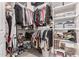 Organized walk-in closet with ample shelving, hanging rods, and storage baskets for clothing and shoes at 21258 W Wilshire Dr, Buckeye, AZ 85396