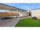 A backyard with a covered patio and a fire pit, creating an inviting outdoor space at 2138 W Beaubien Dr, Phoenix, AZ 85027
