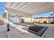 Spacious backyard with covered patio, artificial grass, and cozy seating area at 2138 W Beaubien Dr, Phoenix, AZ 85027