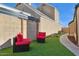 Green backyard featuring lounge seating and partial view of the building at 2138 W Beaubien Dr, Phoenix, AZ 85027