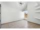 Bright and airy bedroom with neutral paint, modern lighting, and tile flooring at 2138 W Beaubien Dr, Phoenix, AZ 85027