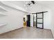 Spacious bedroom with barn door and bathroom entrance at 2138 W Beaubien Dr, Phoenix, AZ 85027