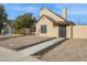 Tan home with black trim, desert landscaping, and a covered entry walkway at 2138 W Beaubien Dr, Phoenix, AZ 85027