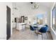 Bright kitchen featuring white cabinetry, stainless steel appliances, and an adjacent dining area with ample natural light at 2138 W Beaubien Dr, Phoenix, AZ 85027