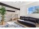 Bright living room with exposed beams, large window, and comfortable seating at 2138 W Beaubien Dr, Phoenix, AZ 85027