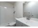 Updated bathroom featuring a single sink and a shower over tub with grab bar at 2440 N 22Nd Ave, Phoenix, AZ 85009