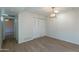 Bright bedroom features modern flooring, closet, and stylish lighting fixture, creating a cozy and inviting atmosphere at 2440 N 22Nd Ave, Phoenix, AZ 85009