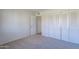 Bedroom with neutral carpet, spacious closet, and open doorway at 2440 N 22Nd Ave, Phoenix, AZ 85009