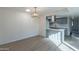 Bright dining area features an eat-in kitchen with gray cabinets, stainless hood, and wood floors at 2440 N 22Nd Ave, Phoenix, AZ 85009