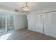 Dining area features a modern light fixture, sliding glass doors to the patio, and closet at 2440 N 22Nd Ave, Phoenix, AZ 85009
