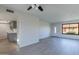 Open living space flows into a modern kitchen, with sleek flooring, updated fixtures, and ample natural light at 2440 N 22Nd Ave, Phoenix, AZ 85009