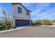 Contemporary two-story home showcasing a dark gray garage door and neutral-colored exterior at 26217 N 19Th Ln, Phoenix, AZ 85085