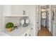 Hallway features built-in cabinetry and a door to the bathroom at 26217 N 19Th Ln, Phoenix, AZ 85085