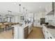 Modern kitchen with a large island, stainless steel appliances, and a view of the dining area at 26217 N 19Th Ln, Phoenix, AZ 85085