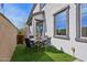 Outdoor dining area with a table and four chairs at 26217 N 19Th Ln, Phoenix, AZ 85085