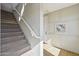 Carpeted staircase with white railing at 26217 N 19Th Ln, Phoenix, AZ 85085
