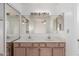 Bathroom vanity area features dual sinks, large mirrors, and great overhead lighting at 2875 W Highland St # 1102, Chandler, AZ 85224