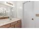 Bathroom features a large mirror and light wood cabinets at 2875 W Highland St # 1102, Chandler, AZ 85224