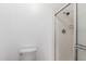 Bright bathroom featuring a tile shower with glass door and neutral colored tile at 2875 W Highland St # 1102, Chandler, AZ 85224