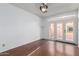 Bedroom features wood floors and French doors leading to the patio at 2875 W Highland St # 1102, Chandler, AZ 85224
