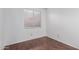 Bedroom featuring wood-look floors and a window with blinds at 2875 W Highland St # 1102, Chandler, AZ 85224