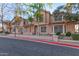 Attractive townhome exterior featuring brick accents, large windows, and manicured landscaping at 2875 W Highland St # 1102, Chandler, AZ 85224