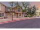 Inviting townhome exterior featuring brick accents, large windows, and manicured landscaping at 2875 W Highland St # 1102, Chandler, AZ 85224