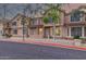Inviting townhome exterior with brick accents, large windows, and manicured landscaping at 2875 W Highland St # 1102, Chandler, AZ 85224