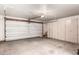 Attached two-car garage with utility cabinets and garage door at 2875 W Highland St # 1102, Chandler, AZ 85224