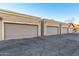 Garage facade featuring neutral colors, unit numbers, and classic architectural design at 2875 W Highland St # 1102, Chandler, AZ 85224