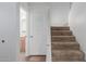 Hallway with stairs and a door leading to a bathroom at 2875 W Highland St # 1102, Chandler, AZ 85224