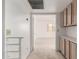 Hallway leading to carpeted bedroom with an abundance of storage cabinets and overhead lighting at 2875 W Highland St # 1102, Chandler, AZ 85224