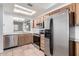 Updated kitchen featuring stainless steel appliances and wood cabinetry at 2875 W Highland St # 1102, Chandler, AZ 85224