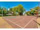 Full basketball court with multiple hoops and a vibrant playing surface, ready for sports and recreation in a community setting at 2966 S Country Club Way, Tempe, AZ 85282