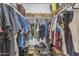Walk-in closet with organized clothing racks and shelves, providing ample storage space for clothes and shoes at 2966 S Country Club Way, Tempe, AZ 85282