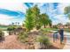 Scenic community park featuring a bench, walking path, mature trees, and lush landscaping at 2966 S Country Club Way, Tempe, AZ 85282