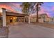 Charming single-story home with covered parking and a well-maintained yard at sunset at 2966 S Country Club Way, Tempe, AZ 85282